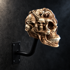 Bonehead Bone skull helmet hanger mounted on a dark wall